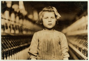 Public Domain. Suggrested credit: Hine/Library of Congress via pingnews. Additional information from source: TITLE: A little spinner in Globe Cotton Mill. Augusta, Ga. The overseer admitted she was regularly employed. Location: Augusta, Georgia. CALL NUMBER: LOT 7479, v. 1, no. 0490[P&P] LC-H5- 490 Check for an online group record (may link to related items) REPRODUCTION NUMBER: LC-DIG-nclc-01583 (color digital file from b&w original print) LC-DIG-nclc-05395 (b&w digital file from original glass negative) RIGHTS INFORMATION: No known restrictions on publication. MEDIUM: 1 photographic print. 1 negative : glass ; 5 x 7 in. CREATED/PUBLISHED: 1909 January. CREATOR: Hine, Lewis Wickes, 1874-1940, photographer. NOTES: Title from NCLC caption card. Attribution to Hine based on provenance. In album: Mills. Hine no. 0490. SUBJECTS: Girls. Textile mill workers. Cotton industry. Spinning machinery. United States--Georgia--Augusta. FORMAT: Photographic prints. Glass negatives. PART OF: Photographs from the records of the National Child Labor Committee (U.S.) REPOSITORY: Library of Congress Prints and Photographs Division Washington, D.C. 20540 USA DIGITAL ID: (color digital file from b&w original print) nclc 01583 http://hdl.loc.gov/loc.pnp/nclc.01583 (b&w digital file from original glass negative) nclc 05395 http://hdl.loc.gov/loc.pnp/nclc.05395 CONTROL #: ncl2004001390/PP